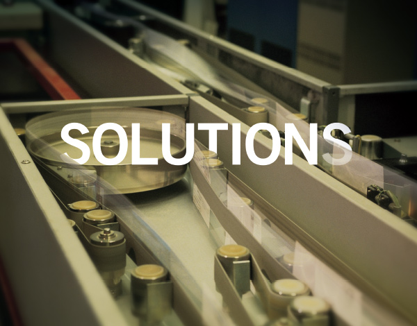 Solutions page from brochure featuring close up of machinery
